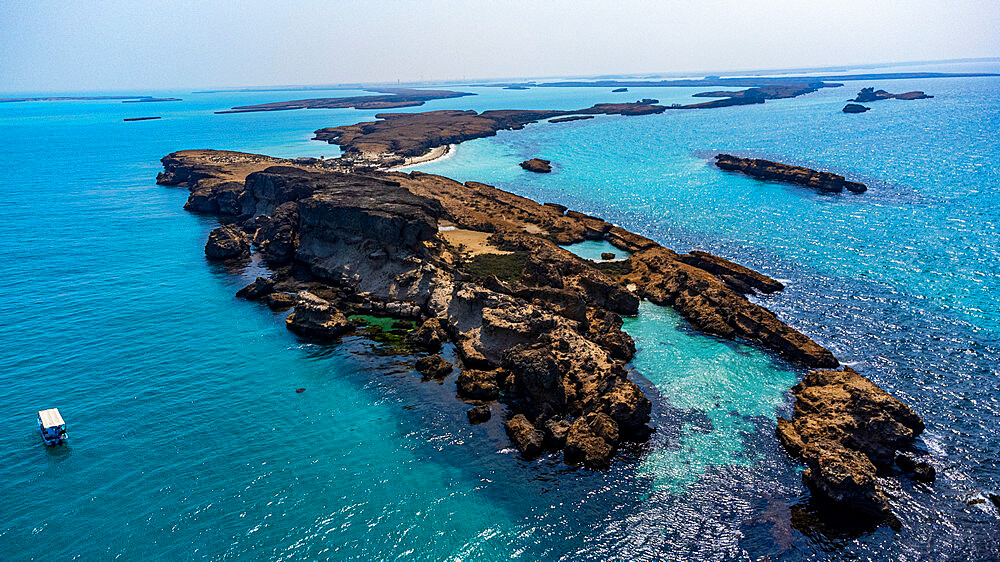 Aerial of a little boat in the Farasan islands, Kingdom of Saudi Arabia, Middle East