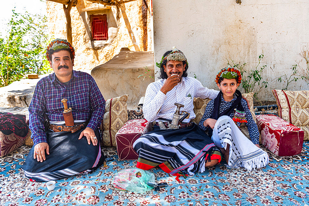 Traditional dressed man of the Qahtani Flower men tribe, with his sons, Asir Mountains, Kingdom of Saudi Arabia, Middle East