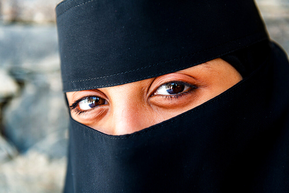 Veiled woman, Rijal Almaa mountain village, Asir Mountains, Kingdom of Saudi Arabia, Middle East