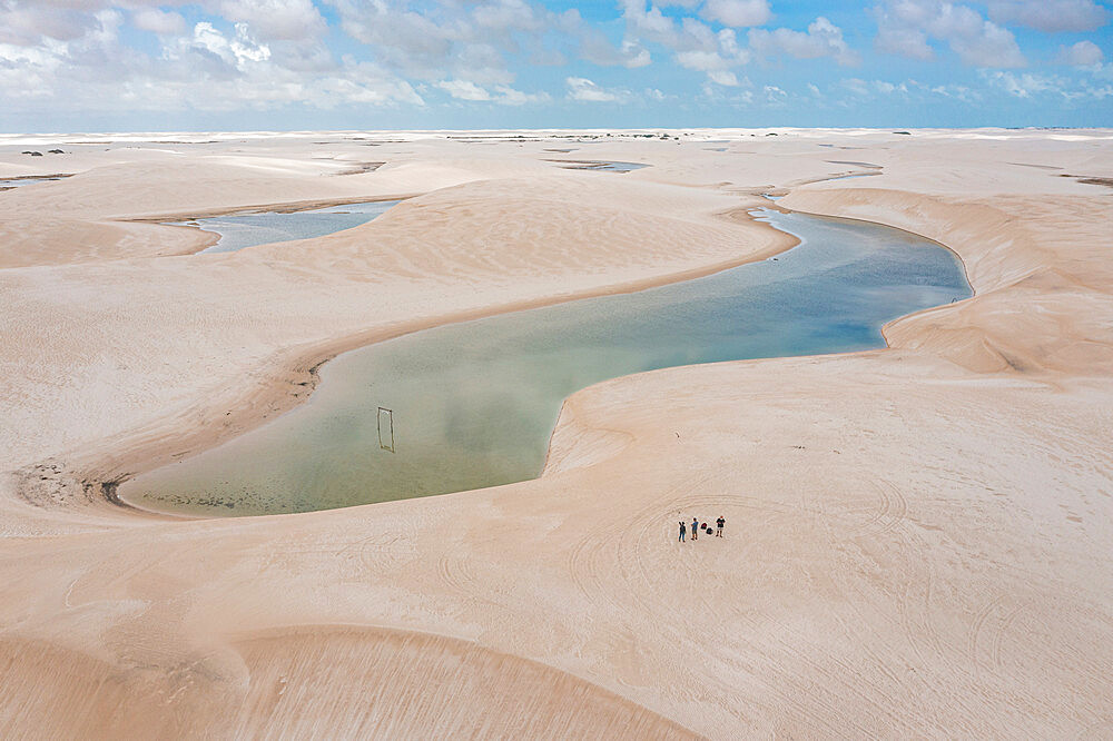 Aerial of freshwater lakes between huge sand dunes in the Lencois Maranhenses National Park, Maranhao, Brazil, South America