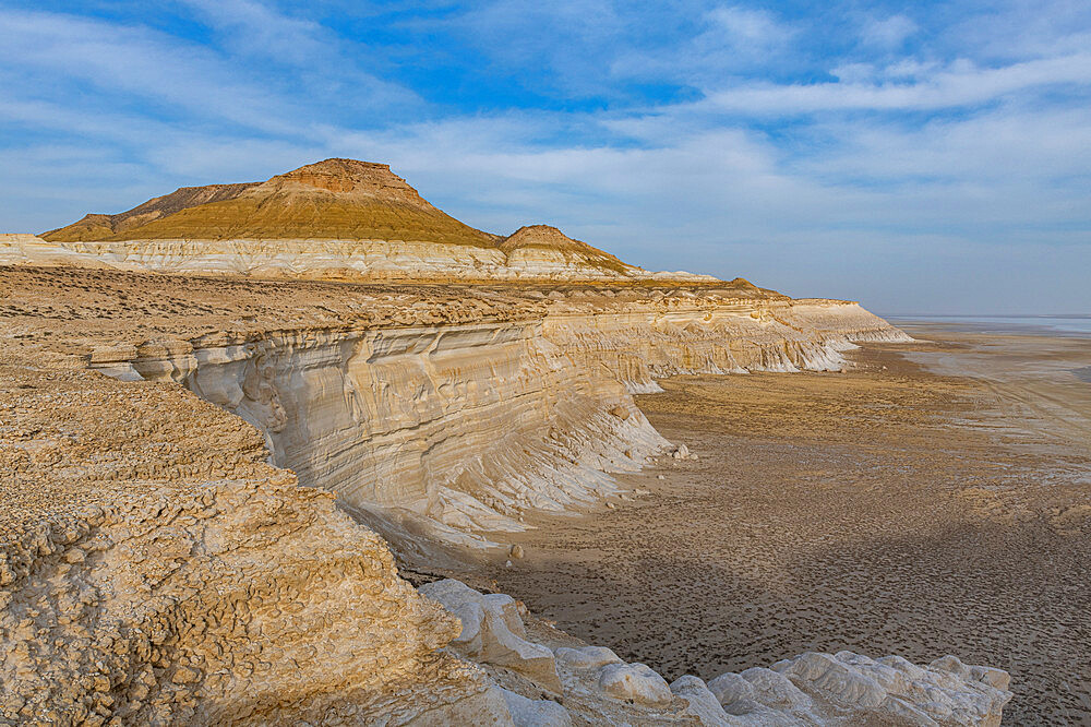 Aerial of massive rock cliff, Sor Tuzbair, a solonchak (salt marsh), Mangystau, Kazakhstan, Central Asia, Asia