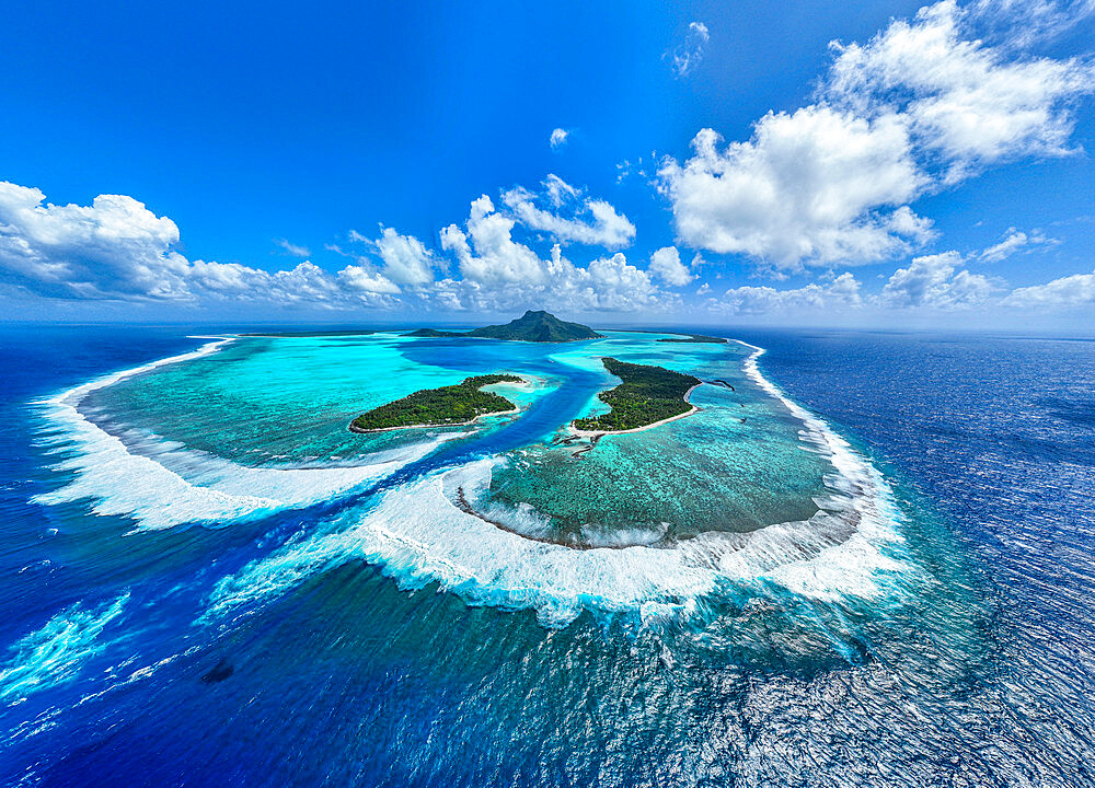 Aerial of the lagoon of Maupiti island, Society Islands, French Polynesia, South Pacific, Pacific