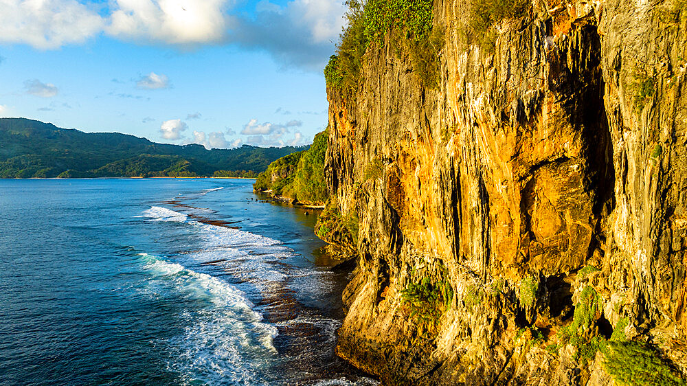 Limestone cliffs at sunset, Rurutu, Austral islands, French Polynesia, South Pacific, Pacific