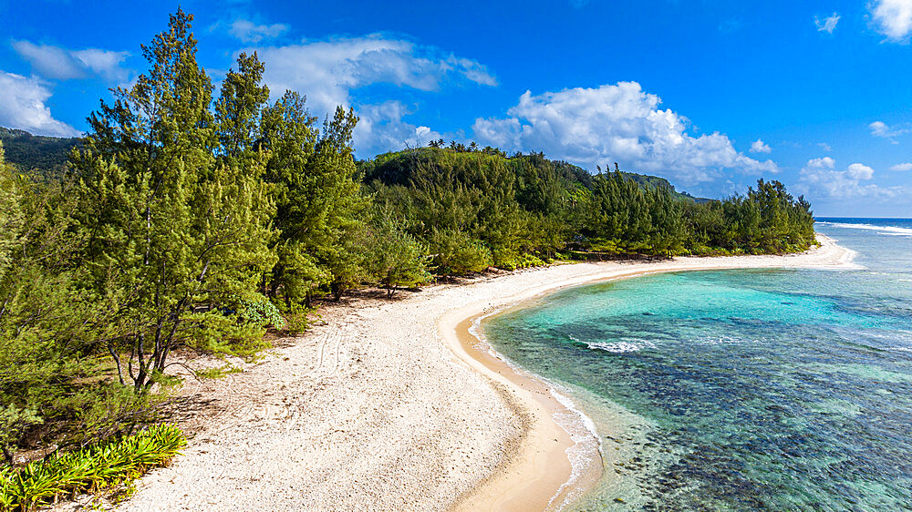 Aerial over the white sand beach, west coast Rurutu, Austral islands, French Polynesia, South Pacific, Pacific