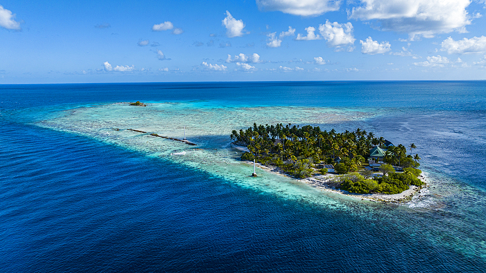 Aerial of the little island at the Avatoru Pass, Rangiroa atoll, Tuamotus, French Polynesia, South Pacific, Pacific