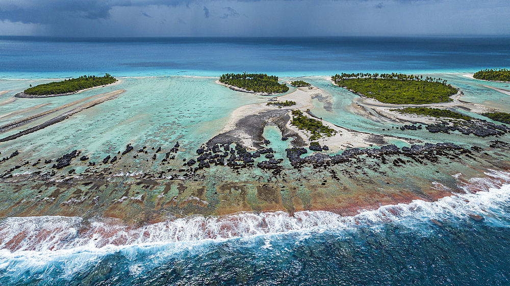 Aerial of the elevated reefs of Ile aux Recifs, Rangiroa atoll, Tuamotus, French Polynesia, South Pacific, Pacific