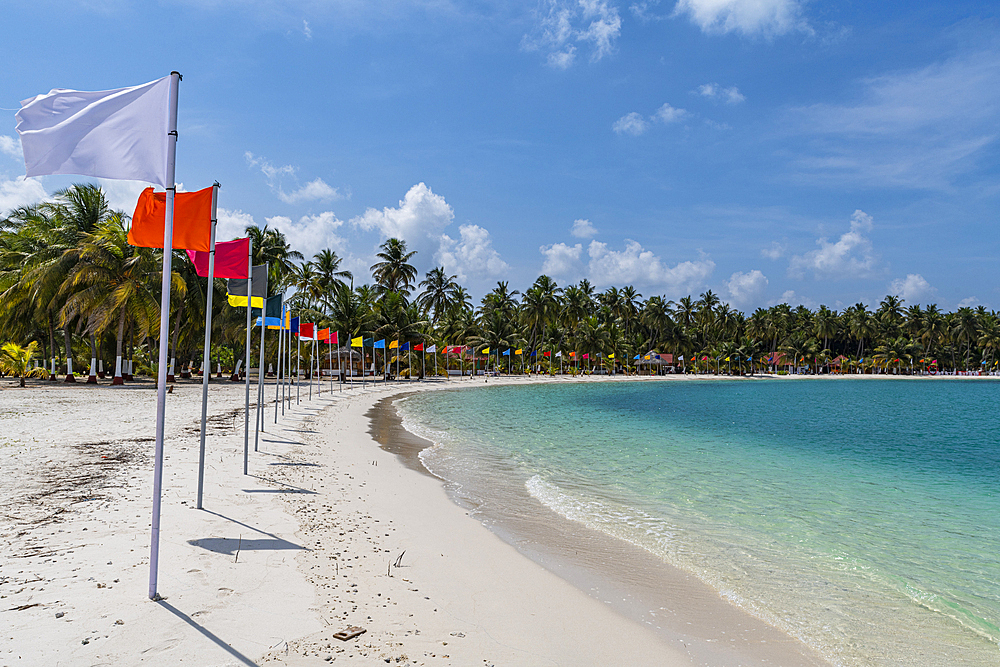 White sand beach with many flags, Bangaram island, Lakshadweep archipelago, Union territory of India, Indian Ocean, Asia