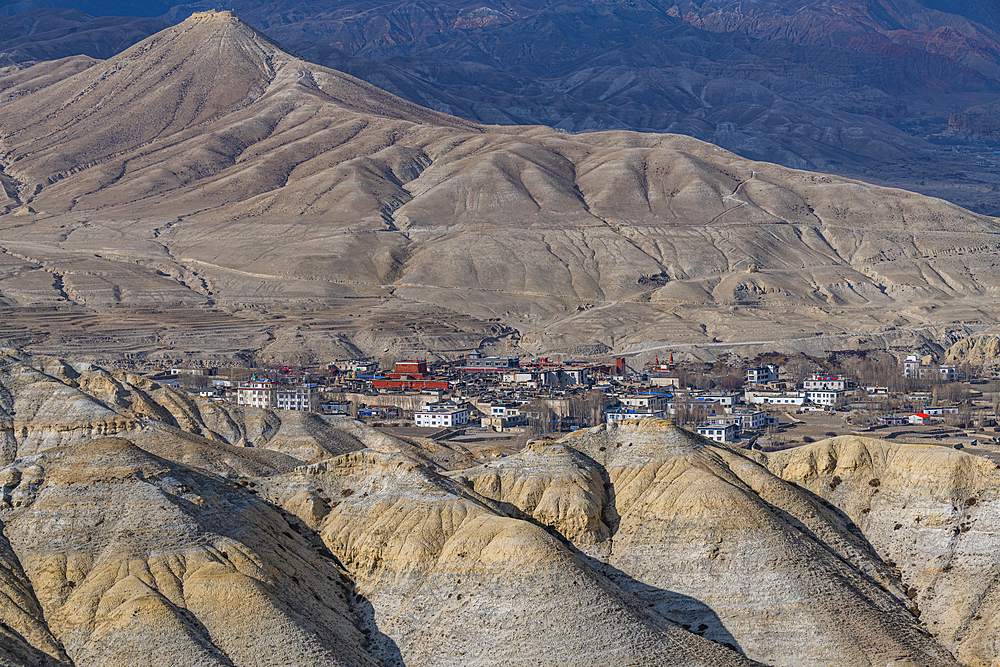 Lo Manthang, capital of Upper Mustang, viewed from a distance amidst a barren desertic landscape, Kingdom of Mustang, Himalayas, Nepal, Asia