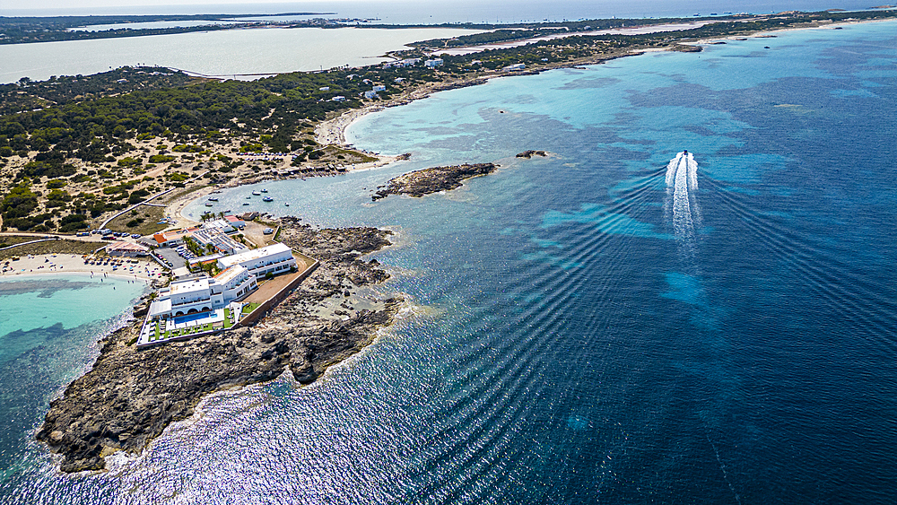 Aerial of the turquoise waters and white sand beach of the Pujols beach, Formentera, Balearic Islands, Spain, Mediterranean, Europe