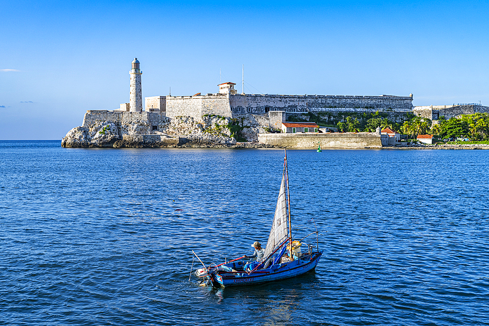 Little fishing boat in front of Fort of San Carlos of the Cabin (Fortaleza de San Carlos de la Cabana (Fort of St. Charles), UNESCO World Heritage Site, Havana, Cuba, West Indies, Central America