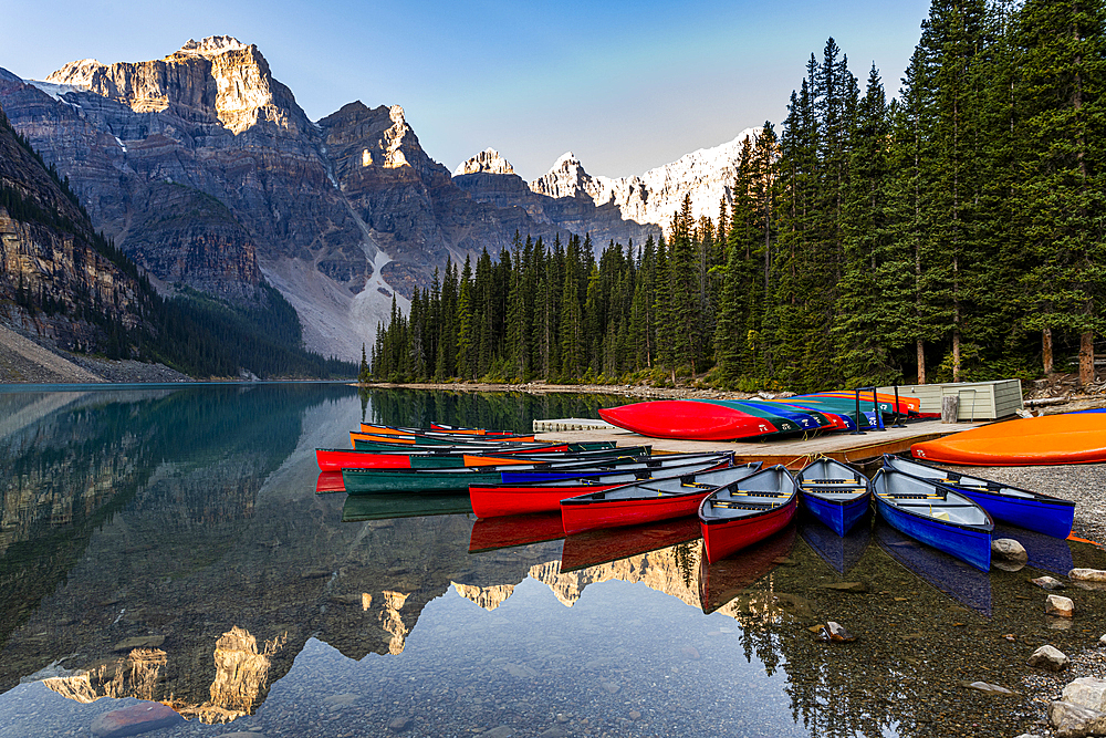 Canoes at sunrise at Lake Moraine, Banff National Park, UNESCO World Heritage Site, Alberta, Rocky Mountains, Canada, North America