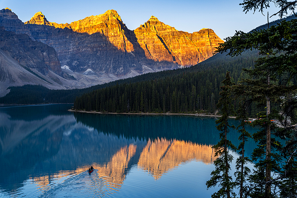 Kayaker at sunrise at Lake Moraine, Banff National Park, UNESCO World Heritage Site, Alberta, Rocky Mountains, Canada, North America