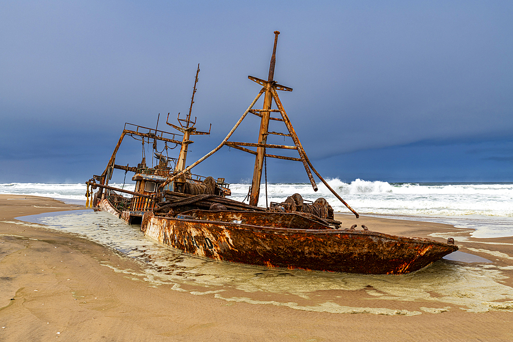 Shipwreck on a beach in the Iona National Park, Namibe, Angola, Africa