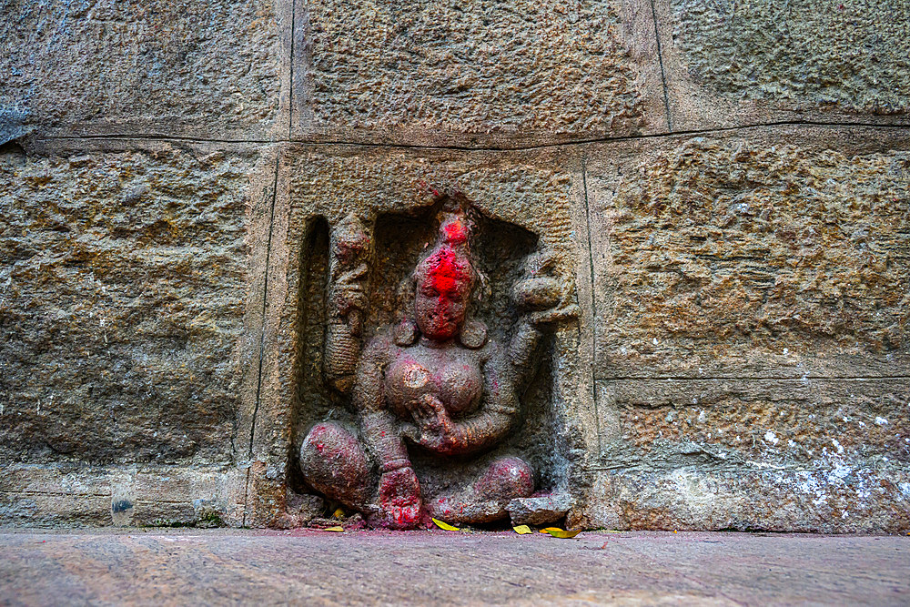 Stone female figure carved in a wall, Kamakhya Temple, Guwahati, Assam, India, Asia