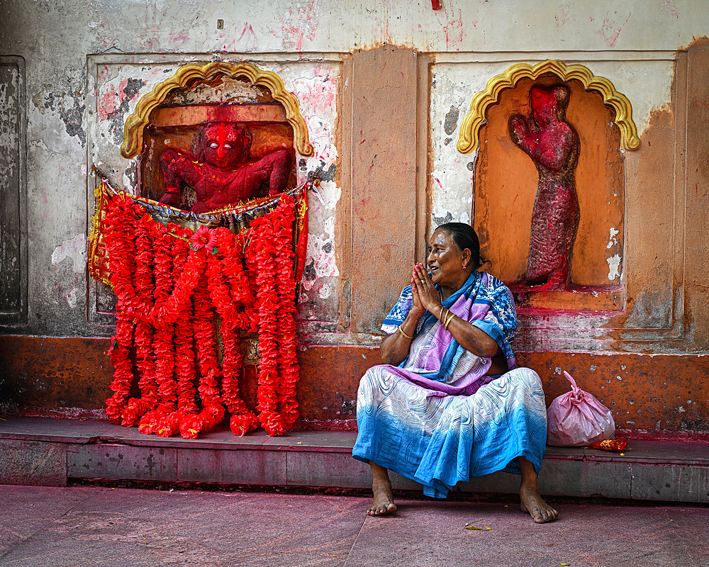 Woman selling flower garlands, Kamakhya Temple, Guwahati, Assam, India, Asia