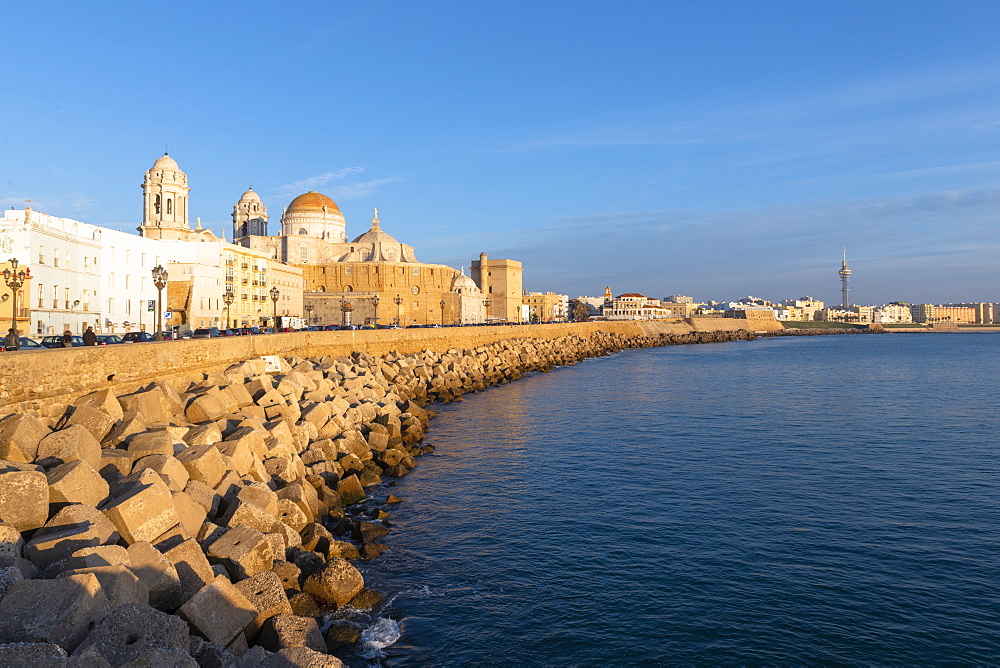 Santa Cruz Cathedral and ocean seen from the promenade along quayside, Cadiz, Andalusia, Spain, Europe