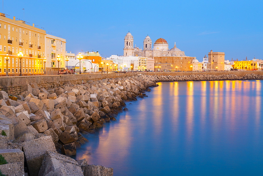 Santa Cruz Cathedral and ocean seen from the promenade along quayside, Cadiz, Andalusia, Spain, Europe