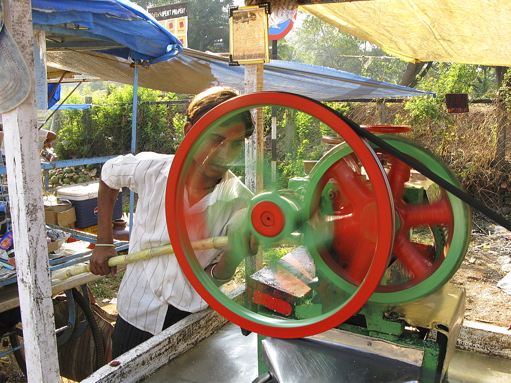 India. Sugar cane juice vendor in mumbai