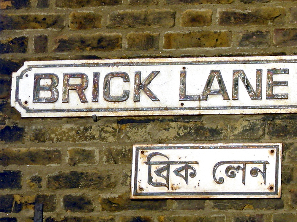 Uk- bilingual road sign in english and bengali in brick lane, east london