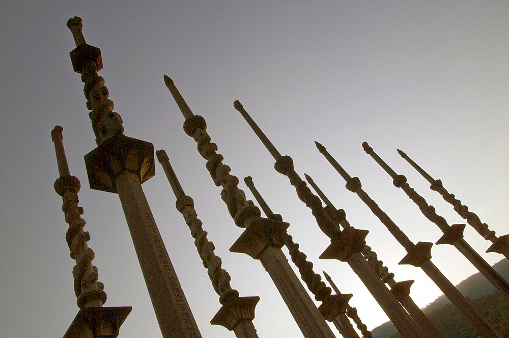 China ceremonial columns showing achievements of ancestors in mandarin exams outside a temple to ancestors in a village in fujian province