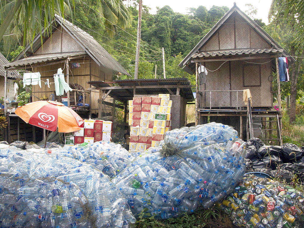 Thailand, recycling bottles and cans at a tourist resort on the island of ko chang