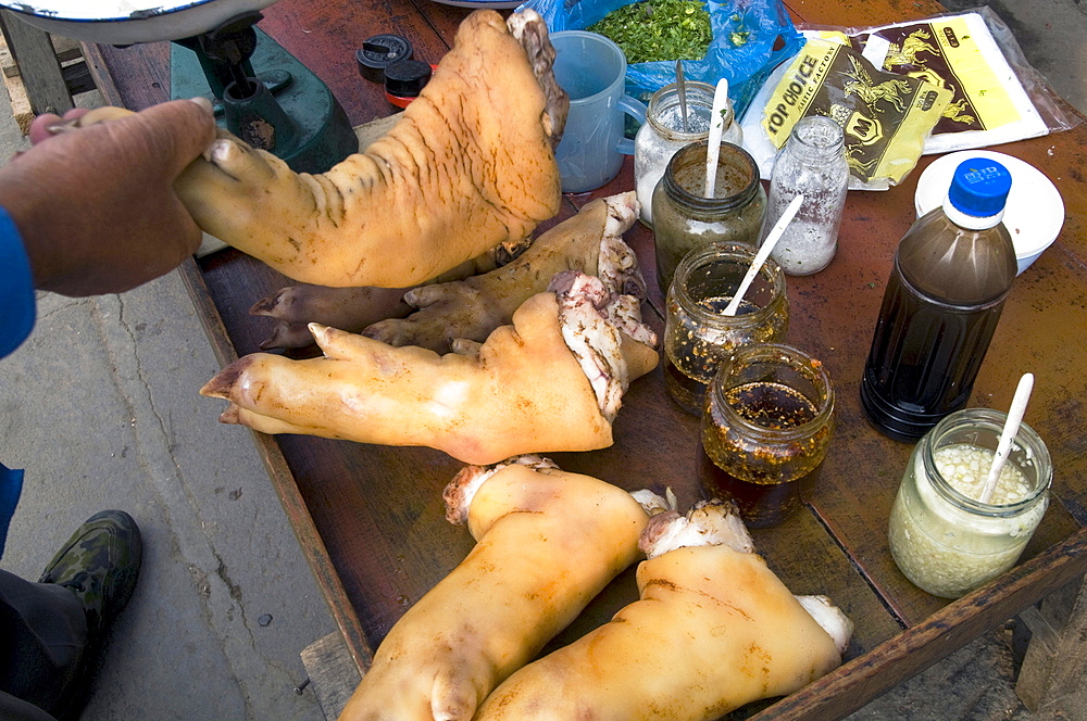 China vendors selling meat at the market place in a village in yunnan province