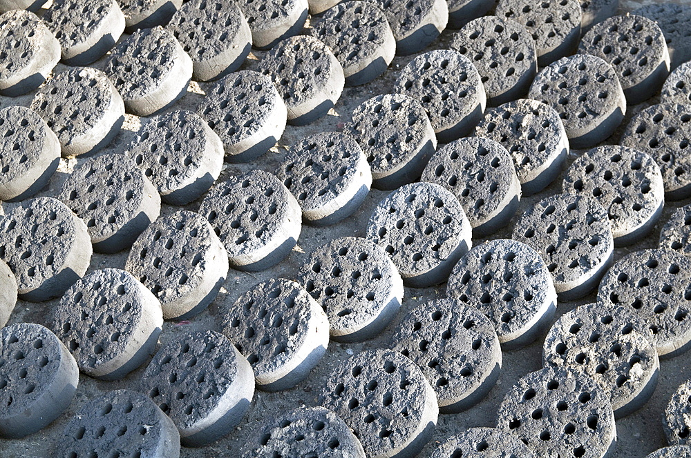 Myanmar (burma) coke burners for domestic fuel drying in a street in mandalay