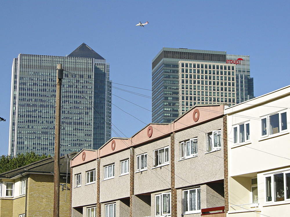 Uk. New office developments and old council houses in canary wharf in east london