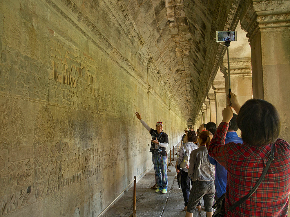 Guide with tourists at the Angkor Wat Archaeological Park, UNESCO World Heritage Site, Siem Reap, Cambodia, Indochina, Southeast Asia, Asia