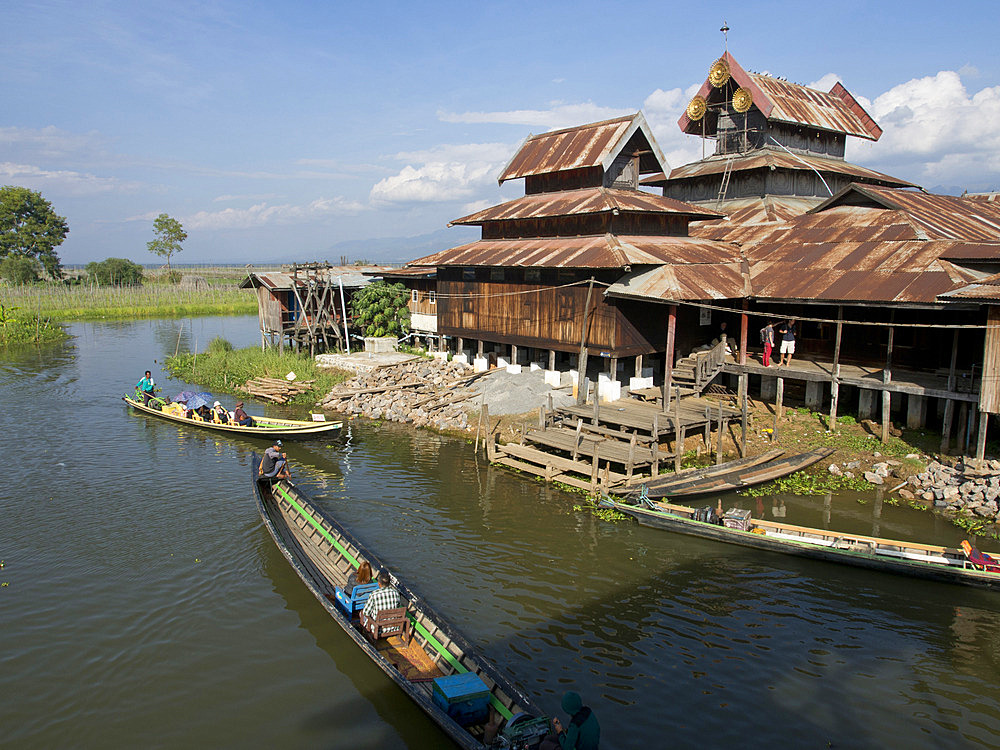 Tourists arrive by boat at monastery on Inle Lake, Shan State, Myanmar (Burma), Asia