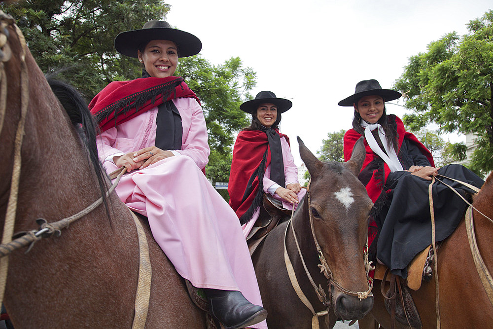 Women in a parade of gauchos in traditional costumes in Salta, Argentina,South America