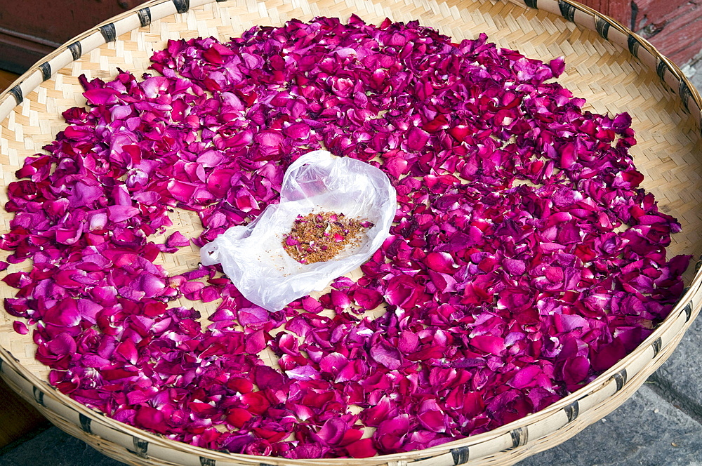 China flower petals drying in the sun in a village in fujian province