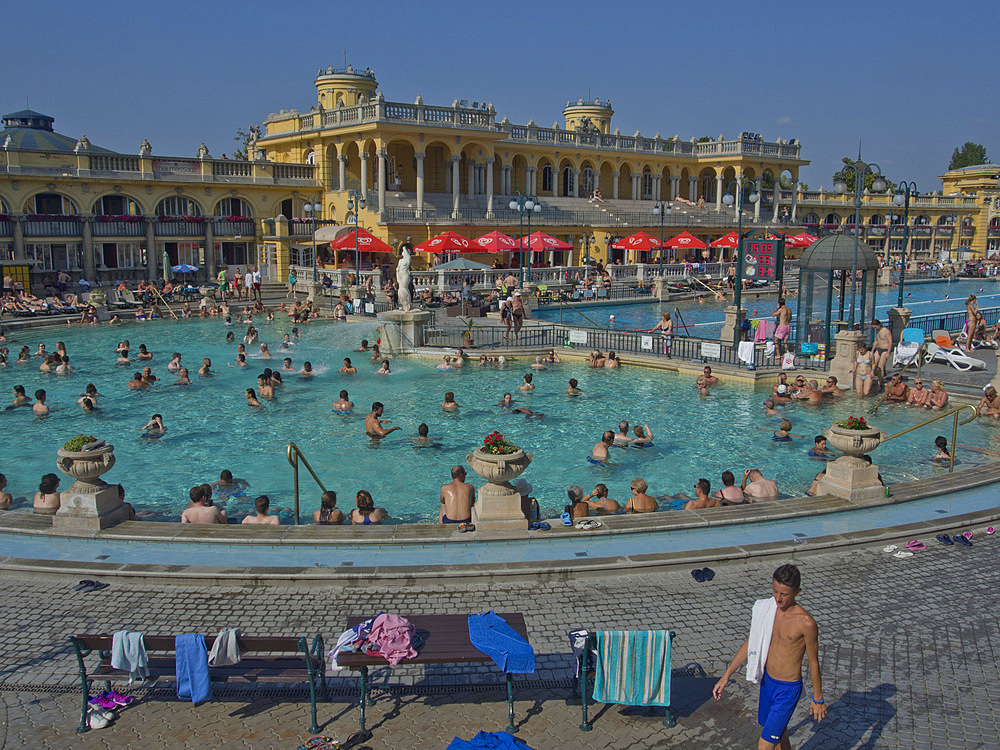 People enjoy the outdoor pools at the Szechenyi Thermal Baths, Budapest, Hungary, Europe