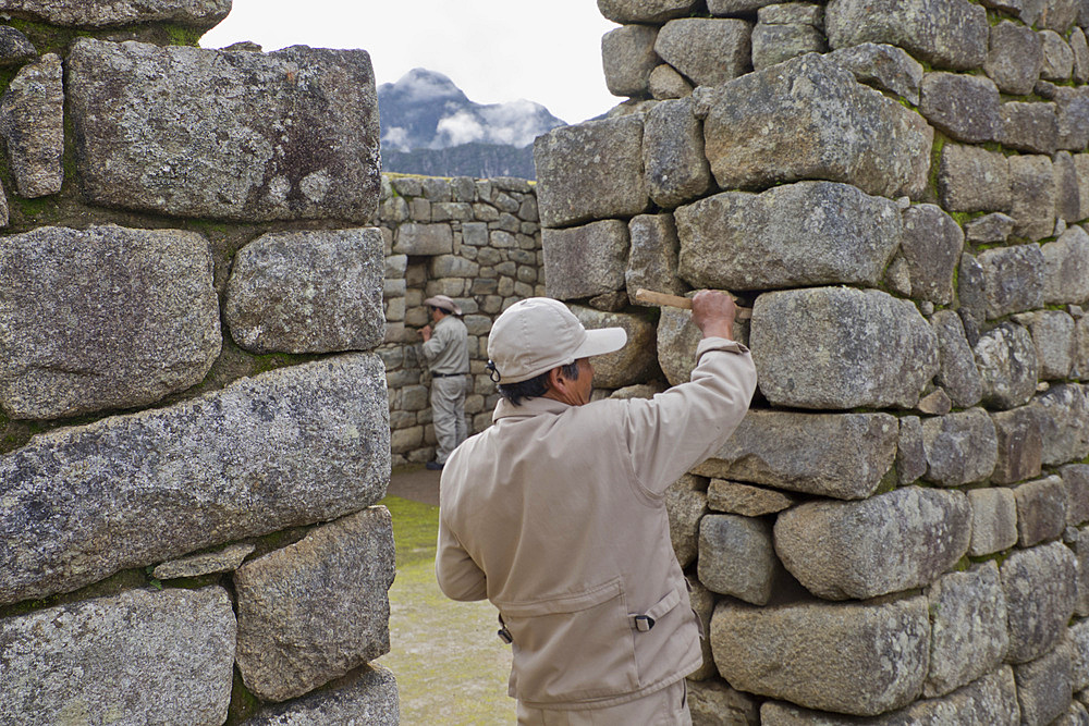 Restoration work at the Inca ruins of Machu Picchu, UNESCO World Heritage Site, Peru, South America