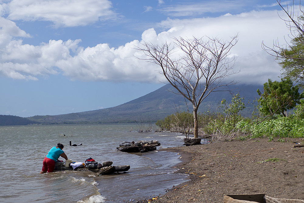 Washer woman on lake at Ometepe Island, Nicaragua, Central America