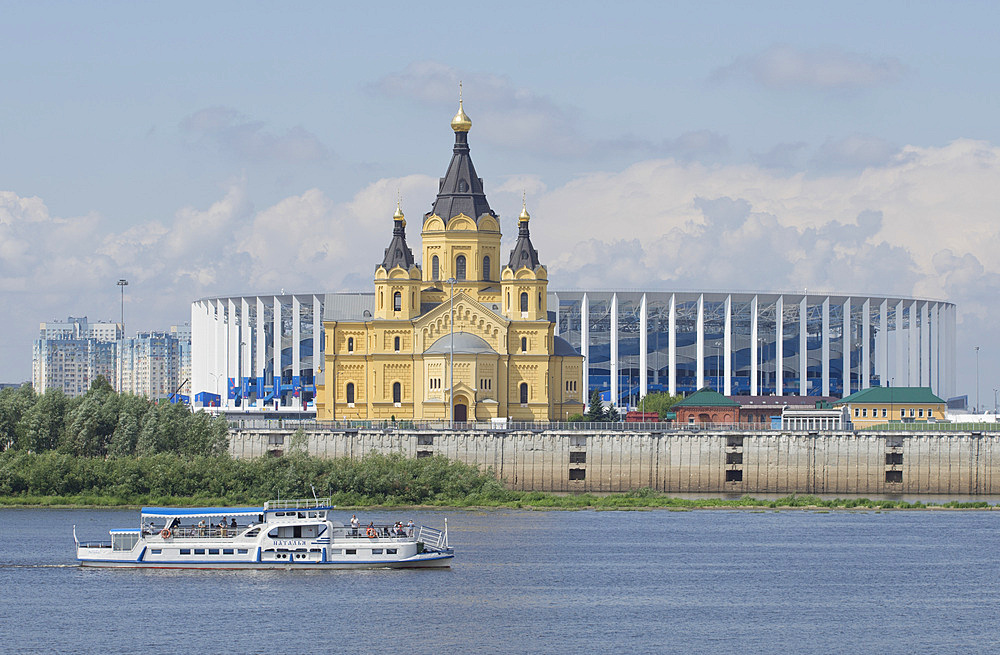 View of the Alexander Nevsky Cathedral and 2018 World Cup football stadium in Nizhny Novgorod across the Volga River, Russia, Europe