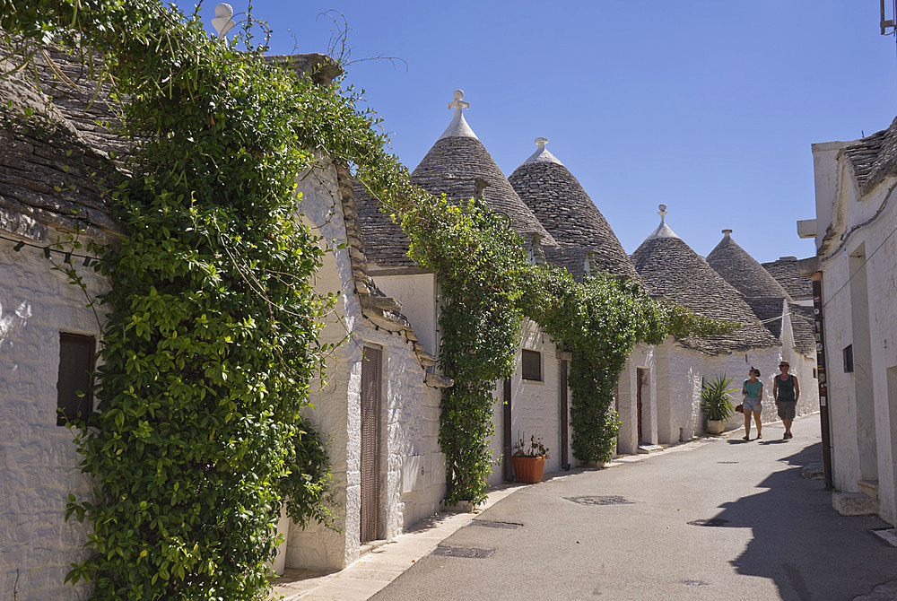 Visitors to the traditional Trullis traditional houses and shops in Alberobello,Puglia,Italy