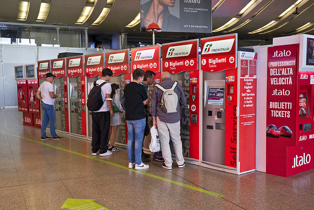 Passengers buying tickets at the Termini train station in Rome,Italy