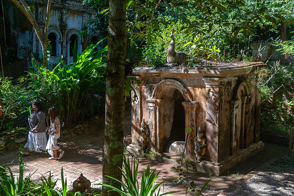 Visitors to the Wat Pha Lat Buddhist temple in the hills above Chiang Mai, Thailand