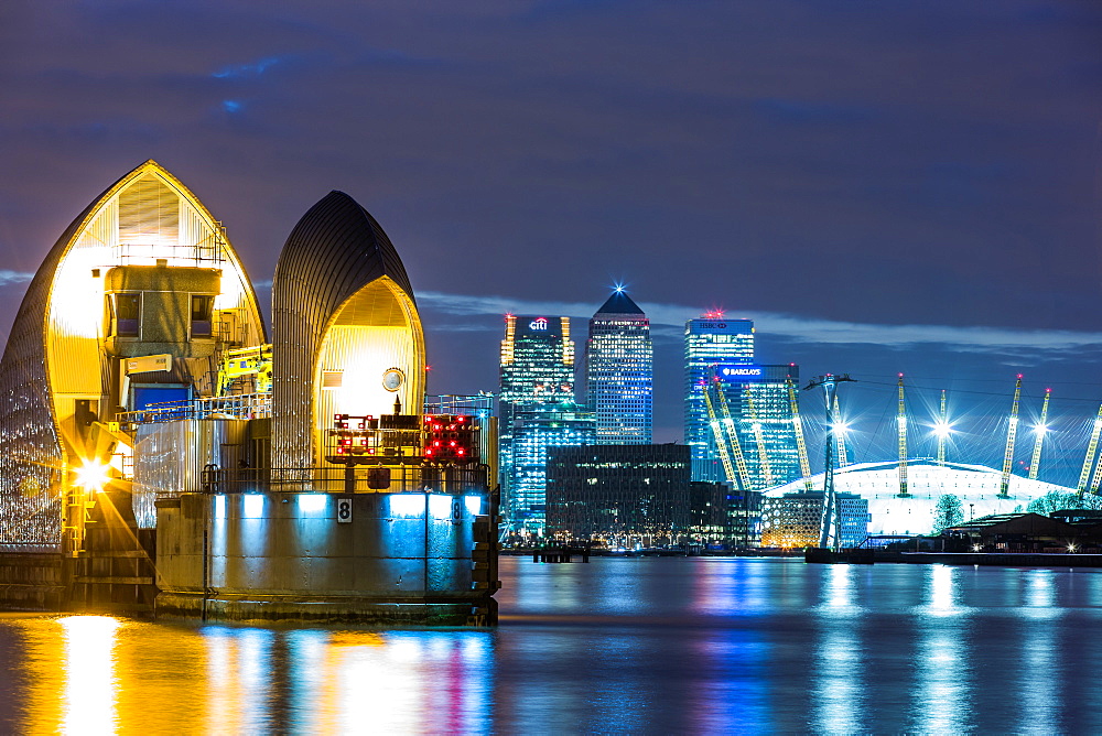 Thames Barrier, Millennium Dome (O2 Arena) and Canary Wharf at night, London, England, United Kingdom, Europe