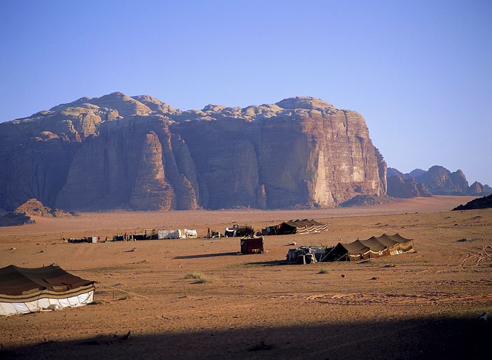 Bedu (Bedouin) tents at Abu Aineh, south of Rum village, with Jebel Khazali in the background, Wadi Rum, Jordan