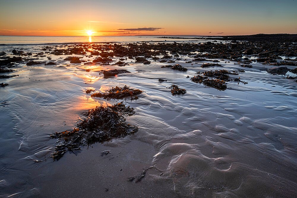 Pools and rocks at low tide, sunrise, Port Eynon Bay, Gower Peninsula, Swansea, Wales, United Kingdom, Europe