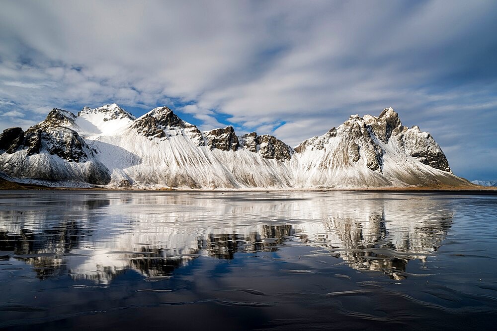 Vestrahorn Mountain reflected in wet sand, Iceland, Polar Regions