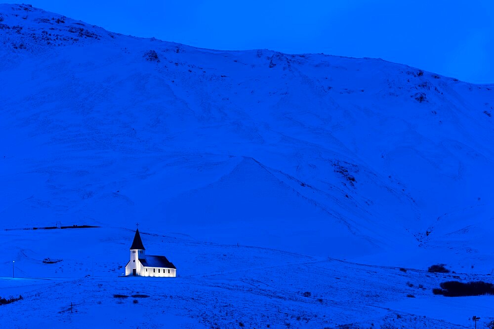 Vik Church illuminated at dawn, Vik, Iceland, Polar Regions