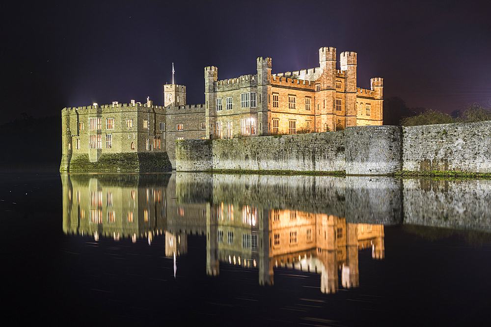 Leeds Castle at night, illuminated, reflected in moat, near Maidstone, Kent, England, United Kingdom, Europe