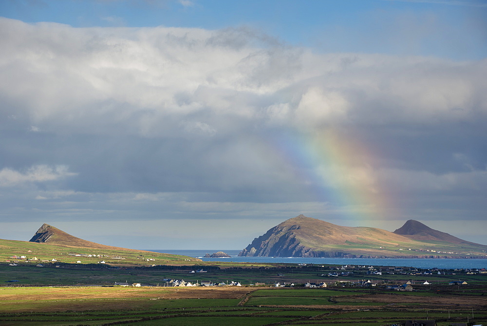 Rainbow over hills and dwellings, looking towards Clogher and Rosroe, Dingle Peninsula, County Kerry, Munster, Republic of Ireland, Europe