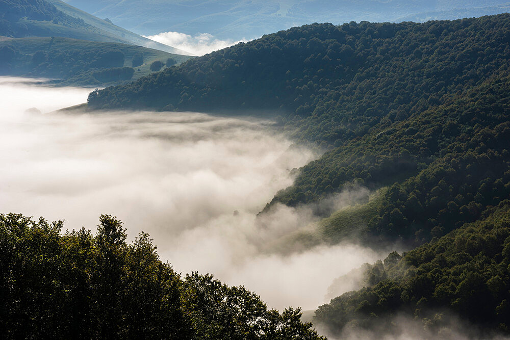 Morning clouds and mist lingering over the Monte Sibillini Mountains, Umbria, Italy, Europe