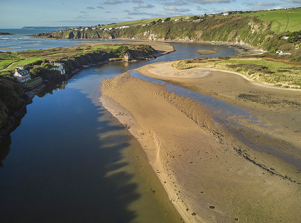 A low tide aerial drone view of the sandy shore and sand banks in the estuary of the River Avon, at Bantham, on the south coast of Devon, Great Britain.