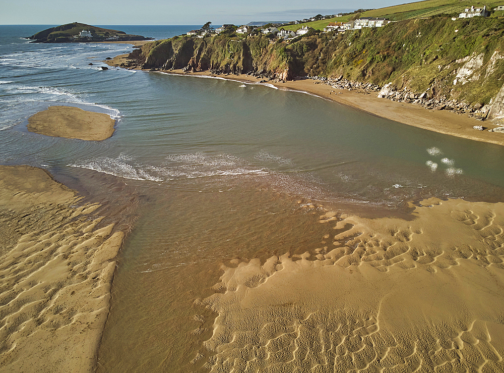 A low tide aerial drone view of the sandy shore and sand banks in the estuary of the River Avon, at Bantham, on the south coast of Devon, Great Britain.
