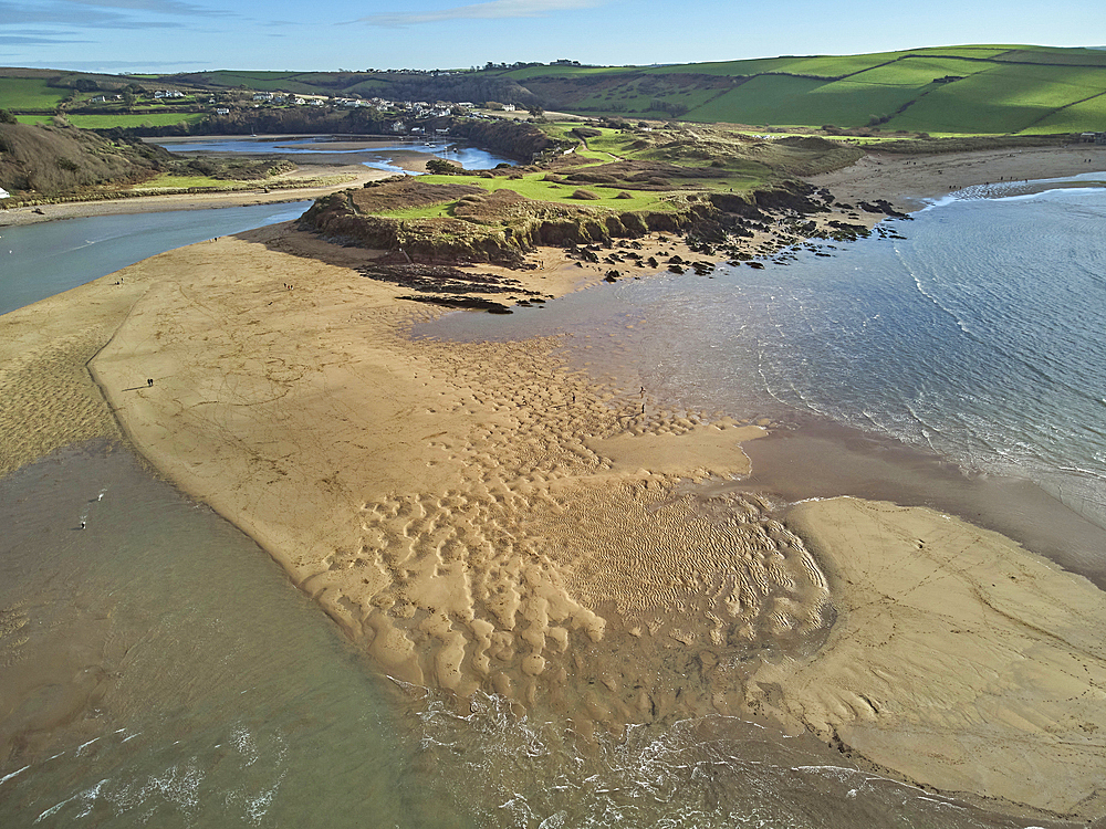 A low tide aerial drone view of the sandy shore and sand banks in the estuary of the River Avon, at Bantham, on the south coast of Devon, Great Britain.